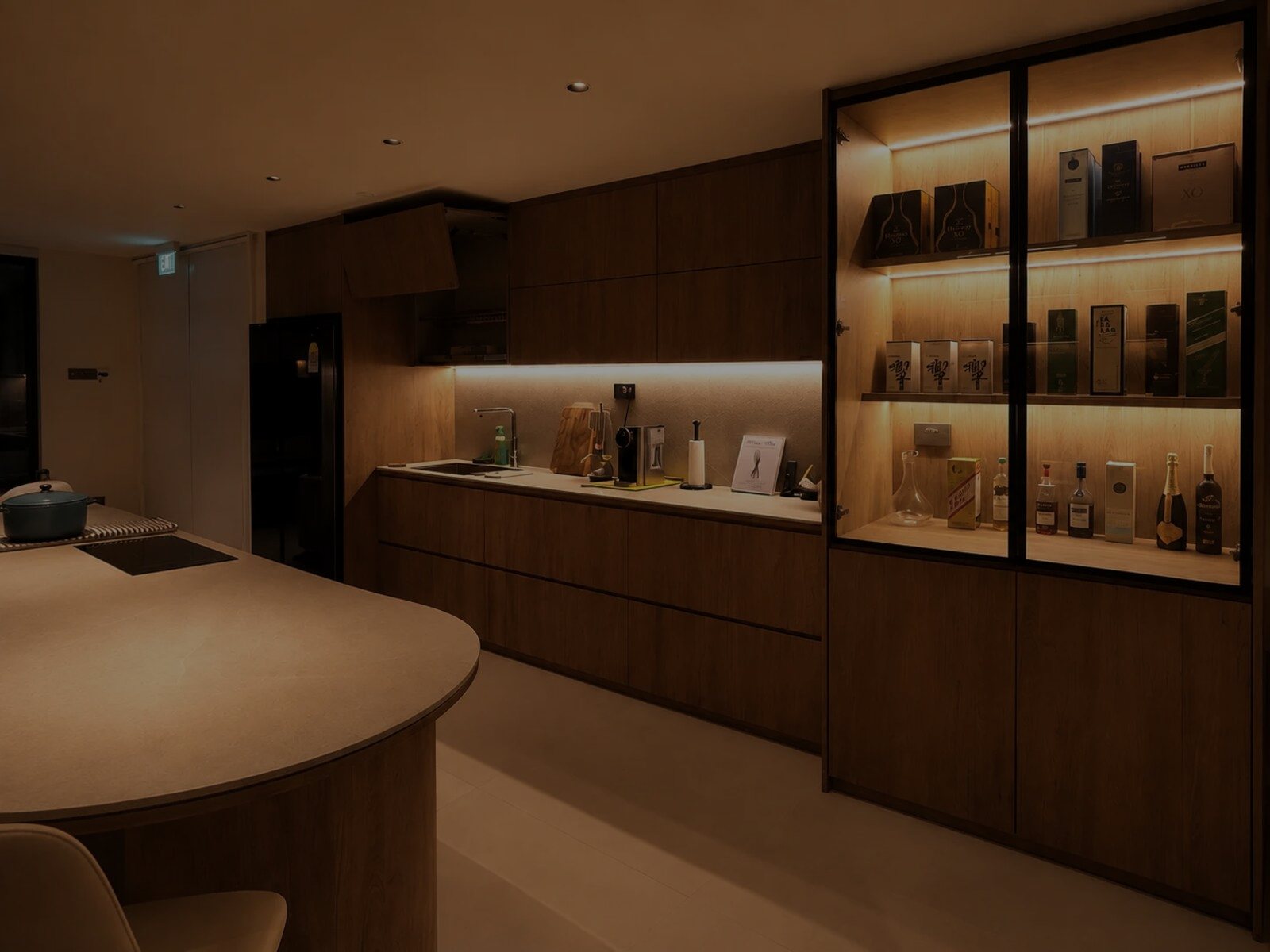 A Zenith Living interior, warm layered light across a kitchen and dining space
